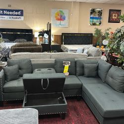 Gray Sectional With Ottoman And Cup Holders 