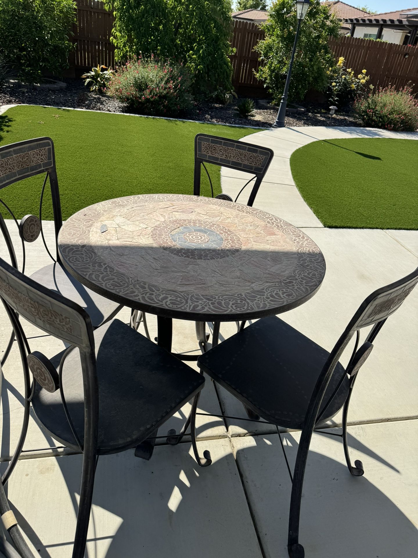 Metal Tiled Patio Table With Four Chairs . 
