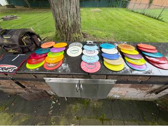 32 used golf, discs and bag