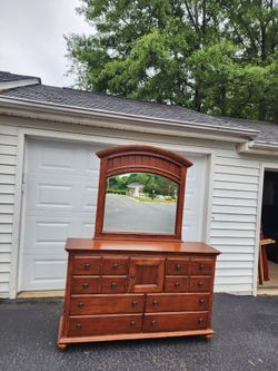 Brown dresser eight-drawers and a door