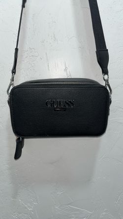 Woman’s black guess purse