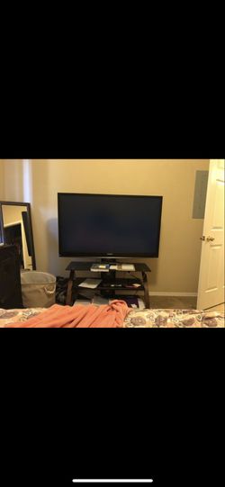 50 inch Mitsubishi tv with swivel tv stand