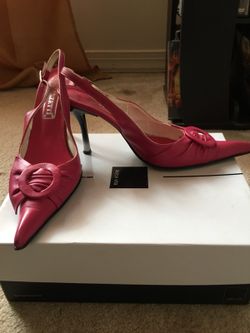 Pair of pink leather pointed heeled shoes