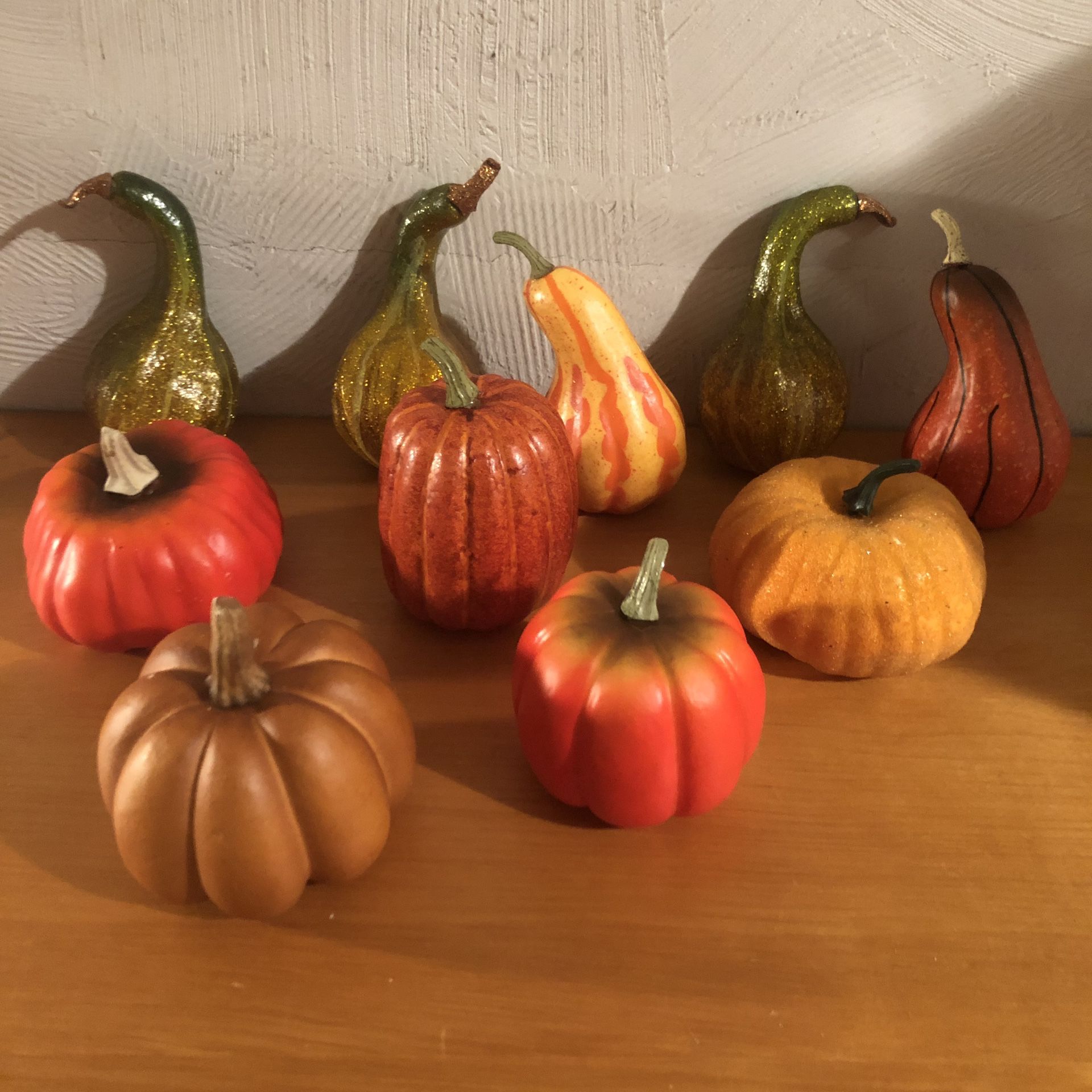 Fall/ harvest decorations. 5 hard plastic like gourds and 5 pumpkins. Some have glitter made on them and all came from Michael’s so great for crafts