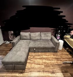 Grey Sofa/pullout bed with storage (If its posted It's available don't ask)