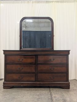 Dark Wood Six-Drawer Dresser with Rounded Mirror
