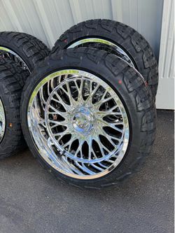 NEW 22x12 mirror chrome fittipaldi wheels wrapped in 285/45r22 RBP tires