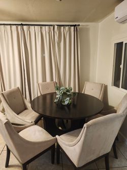 Round Dark wood dining table and fabric chairs