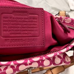 This is a Coach Op Art Leah pink convertible crossbody bag.  Includes wallet.