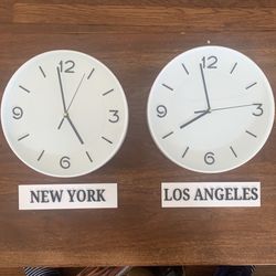 2 Clocks With New York And Los Angeles Plates