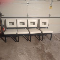 4-white leather chairs