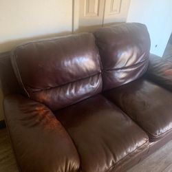 brown leather couch and sofa