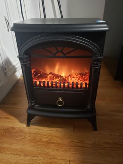 Electric heater/fireplace. $60