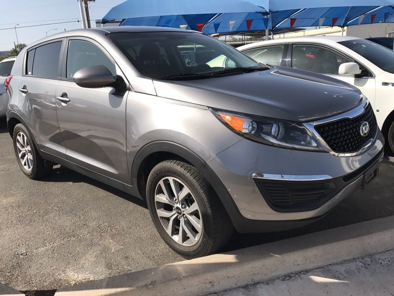 Kia Sportage or Ford Explorer or GMC Yukon SUV or