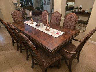 Solid wood table 8 chairs and two piece Hutch very nice need gone asap