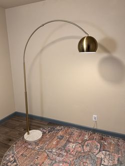 Modern brass arc floor lamp