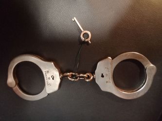 Vintage H.W.C stainless steel handcuffs.