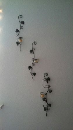 Grape leaves candle holders on wall