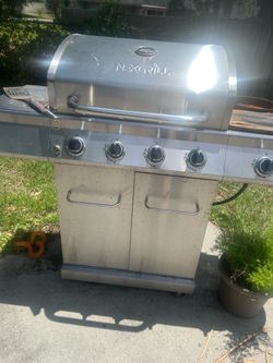 Grill with multiple starters and a side set to cook a skillet on