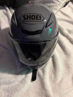 Black Shoei Motorcycle Helmet with Red Accents