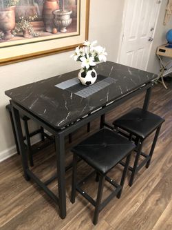 Counter height black faux marble bar table set with 4 leather barstools