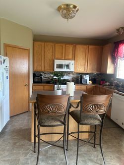 A Pair Of Bar Chairs