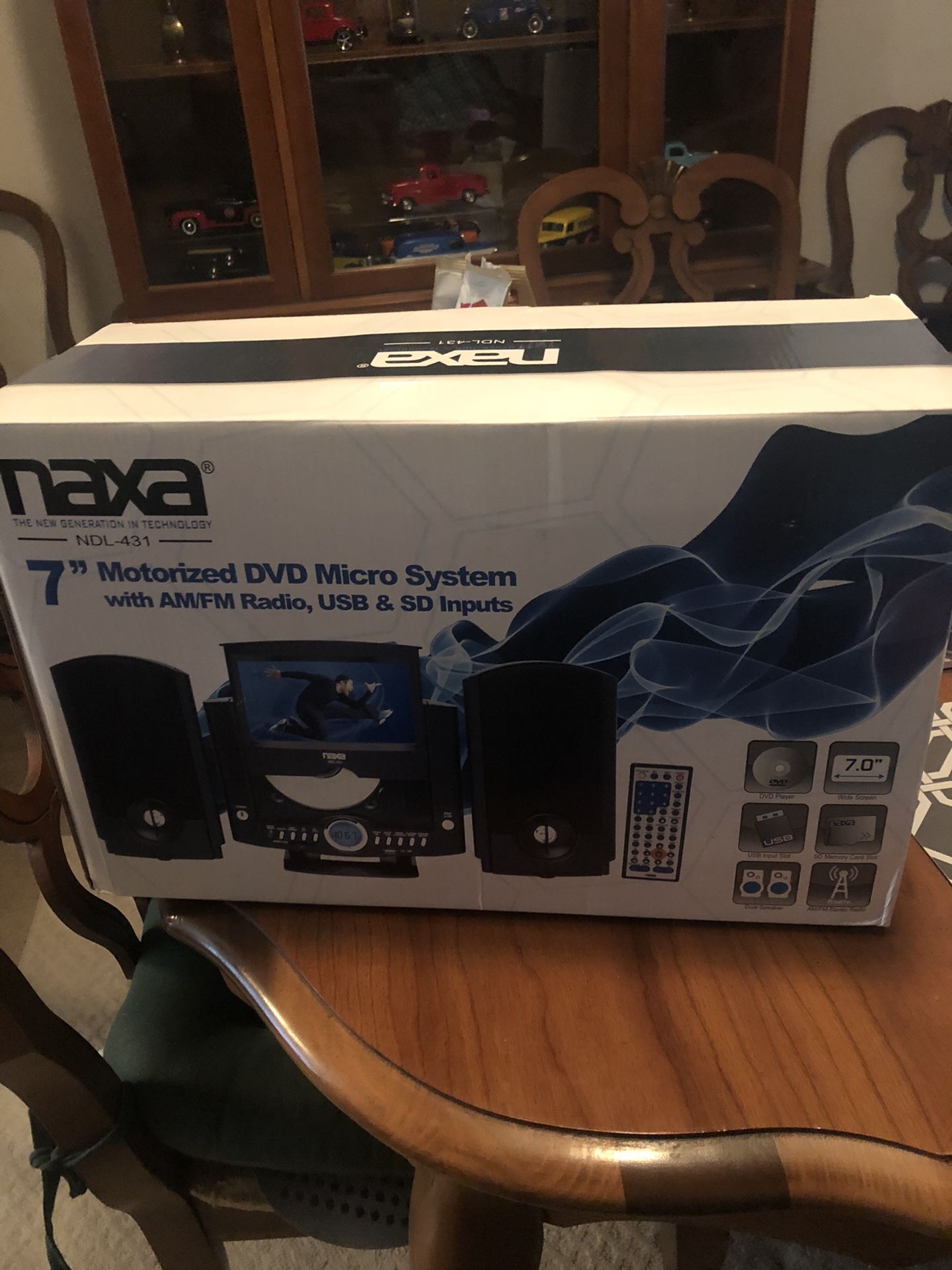 NAXA 7” Motorized DVD Micro System AM/FM Radio, USB & SD Inputs