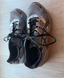 These are ASICS Gel-1130 sneakers in a "Sleet Black" or "Black Blue Silver" colorway, featuring metallic silver mesh and signature GEL cushioning