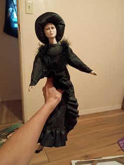 This is a reproduction boudoir doll produced in the early 1980’s (I think). You can usually find a few for sale on eBay. Fun find!