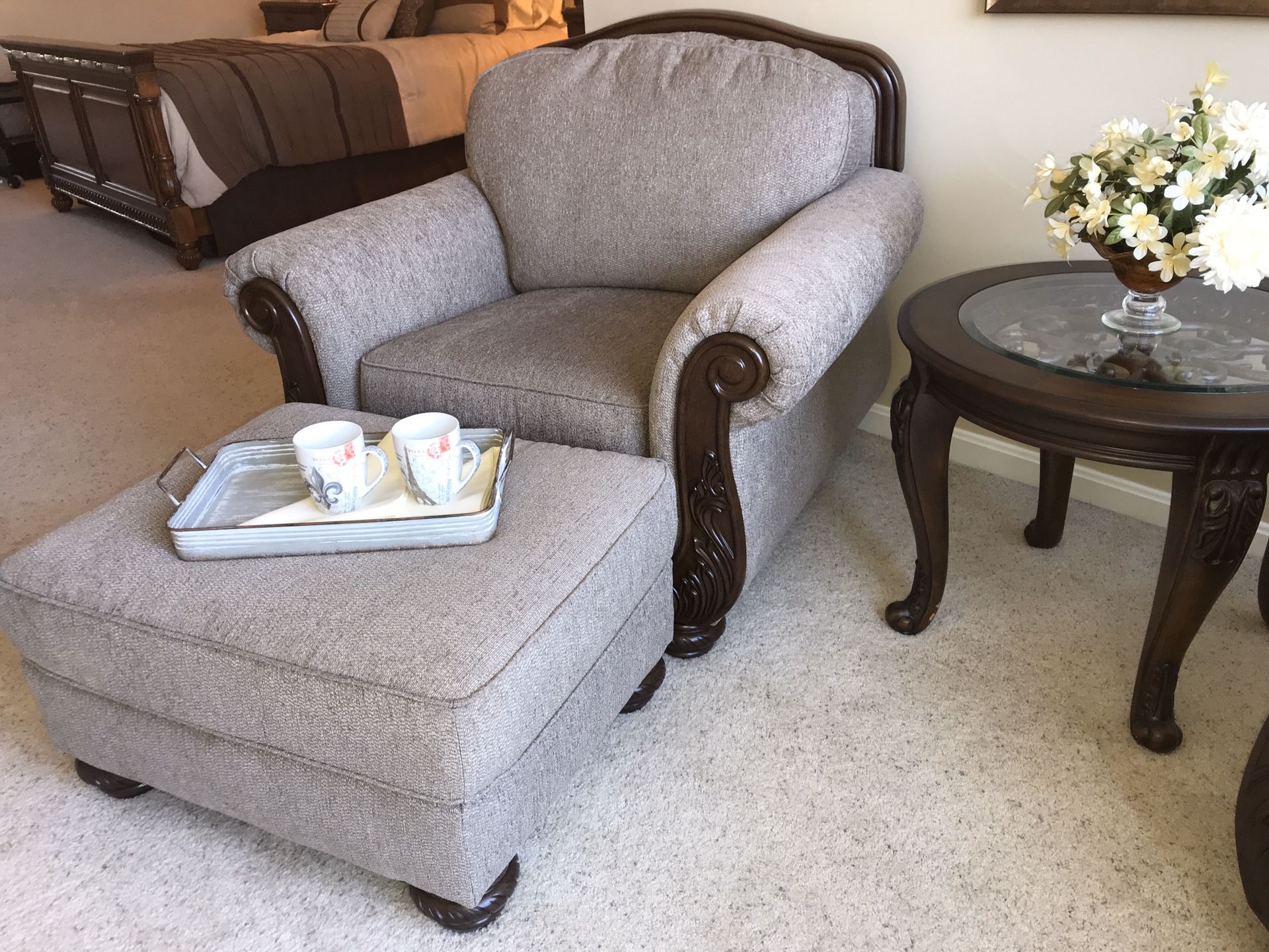 Pair of overstuffed lounge chairs, ottoman, and round table