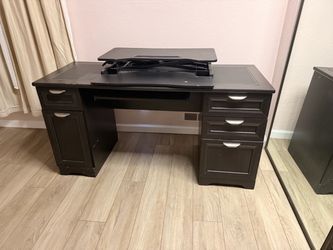Desk with standing desk attachment