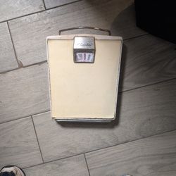 vintage Counselor brand mechanical bathroom scale, likely dating from the 1950s. 
