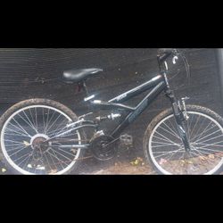 Next PX 4.0 full suspension mountain bike. Boys 24" wheel, 18 speed Shimano equipped