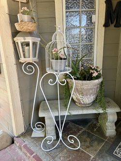 Flower stand with succulents in it
