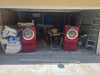Washer and dryer set with pedestals and laundry top