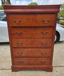 7 drawer cherry wood dresser. Can deliver