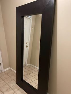 Mirror with black wood frame
