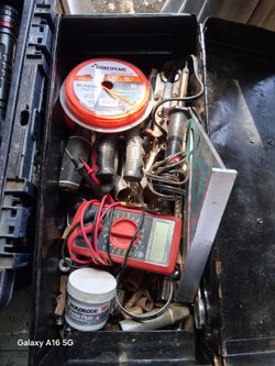 Tool box with assorted tools  and a long rope