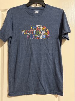 The North Face, men’s small, blue with multicolored logo, short sleeve shirt.