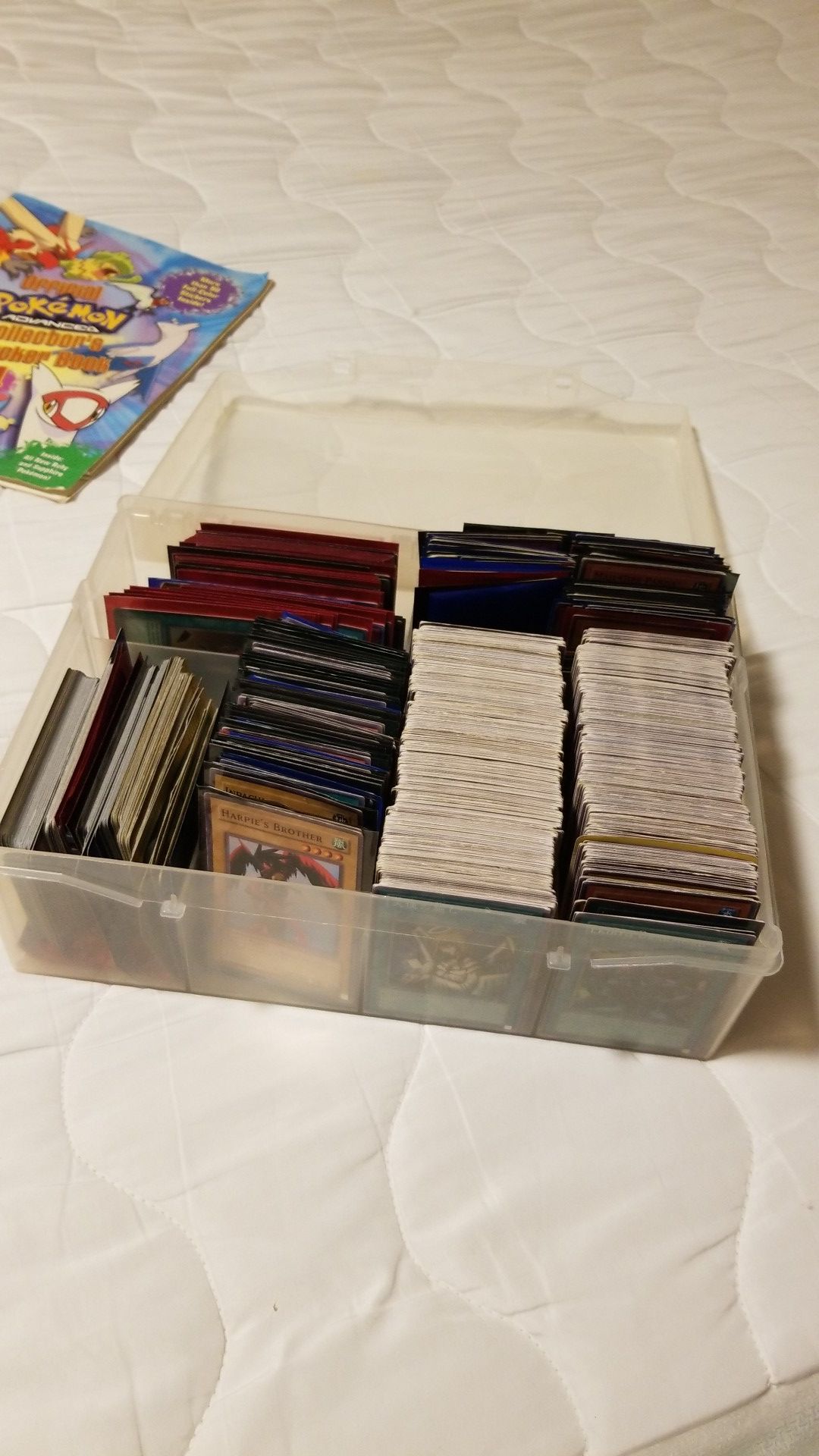 Huge collection of about 1750-2000 yugio and pokemon cards. A few rare cards in the mix.