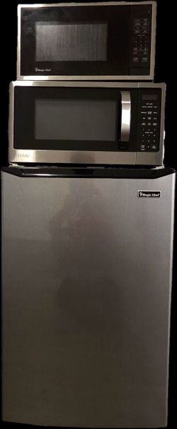 Two  microwaves and one Magic Chef mini fridge.