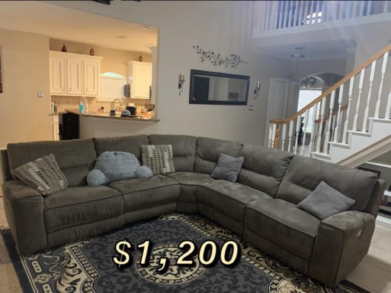 Sectional couches with electric end seats that recline. And tv stand for sale..