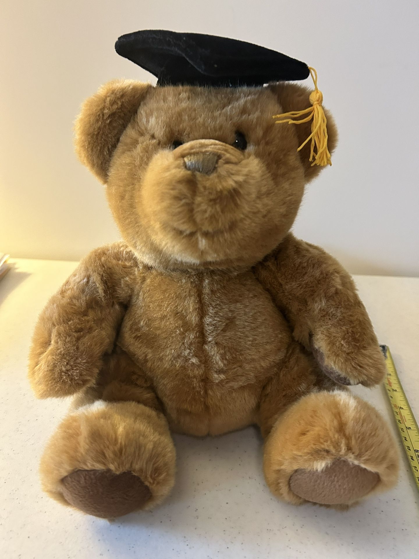 Graduation stuffed brown teddy bear.