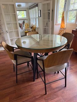 Dining room table glass top  w/four chairs