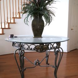 Wrought iron and marble dining table