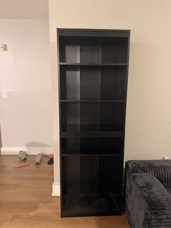 Black shelf with 4 changeable spaces