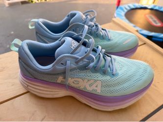 HOKAS  WOMENS12 MEN 10.5