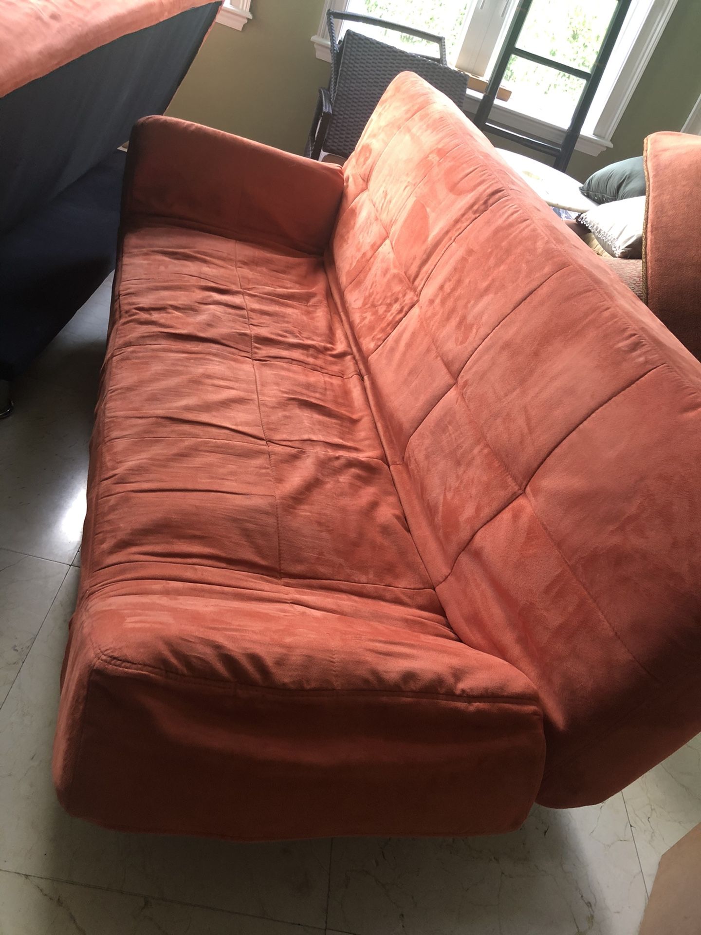 2 Micro suede sofas futons - Orange. I have 2 available for sale