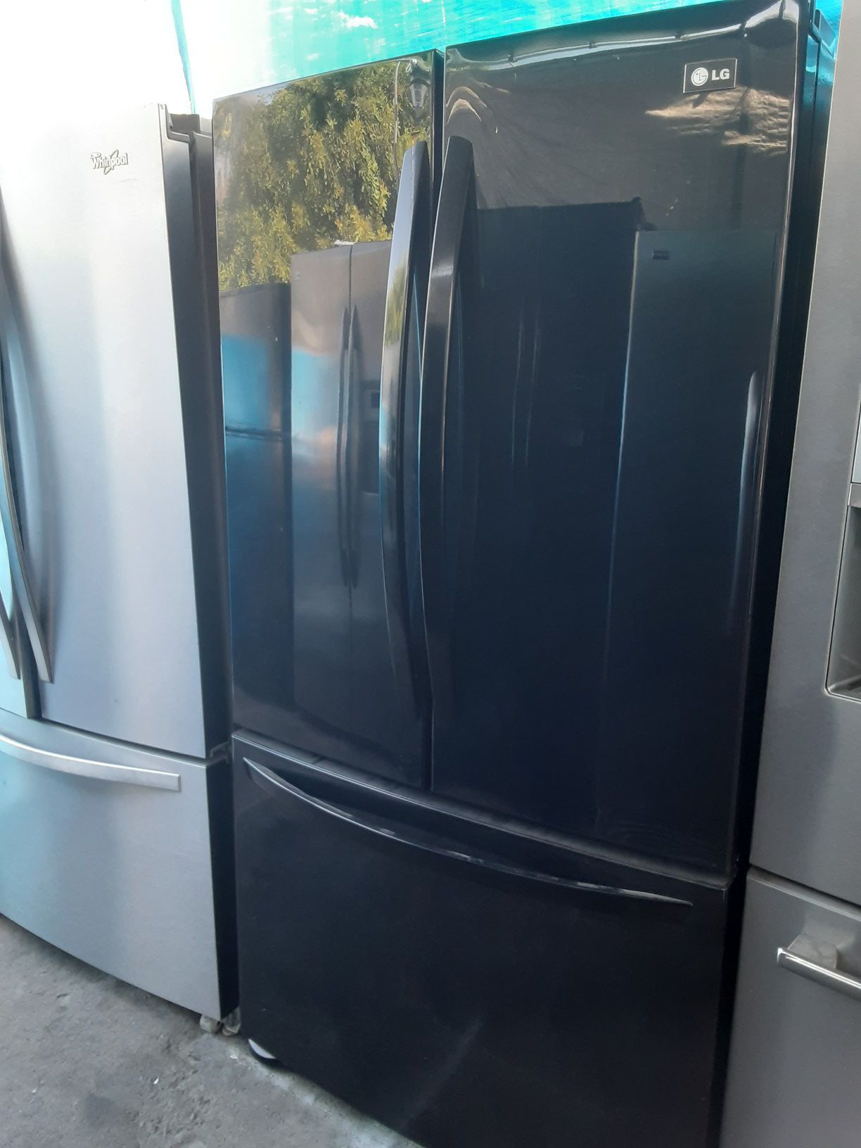 $599 LG black gloss finish French door bottom freezer fridge includes delivery in the San Fernando Valley a warranty and installation
