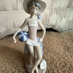 Lladro Figurine- Girl in swimsuit, with Beach ball & seashell 